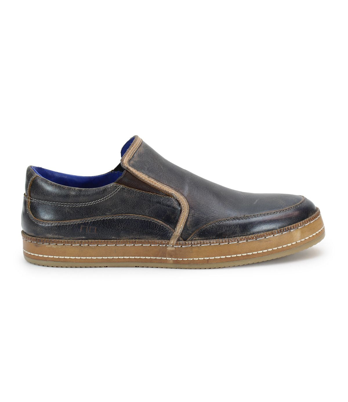 Bed|Stü Freestyle slip-on sneaker in brown leather with visible stitching, tan rubber sole, and a low-profile design featuring leather trim, shown from the left side against a white background.