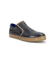 Introducing the Bed|Stü Freestyle: a dark brown leather slip-on sneaker accented with a tan sole and stitching, blue inner lining, and a refined leather trim.