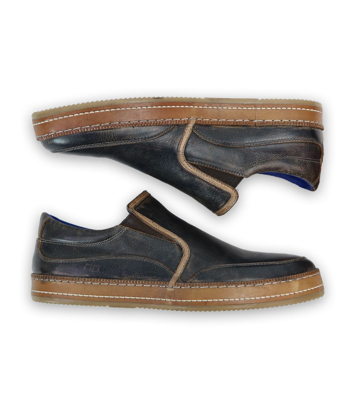 A pair of Bed|Stü Freestyle black leather slip-on sneakers with brown soles, leather trim, and visible stitching, displayed side by side on a white background.