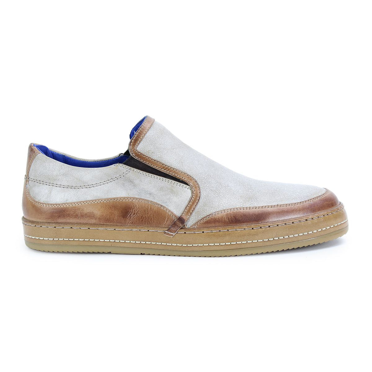 Experience effortless comfort with the Bed|Stü Freestyle slip-on sneaker, showcasing a light beige upper accented by tan leather trim and set on a tan rubber sole—presented from the side against a white background for an easygoing, stylish look.