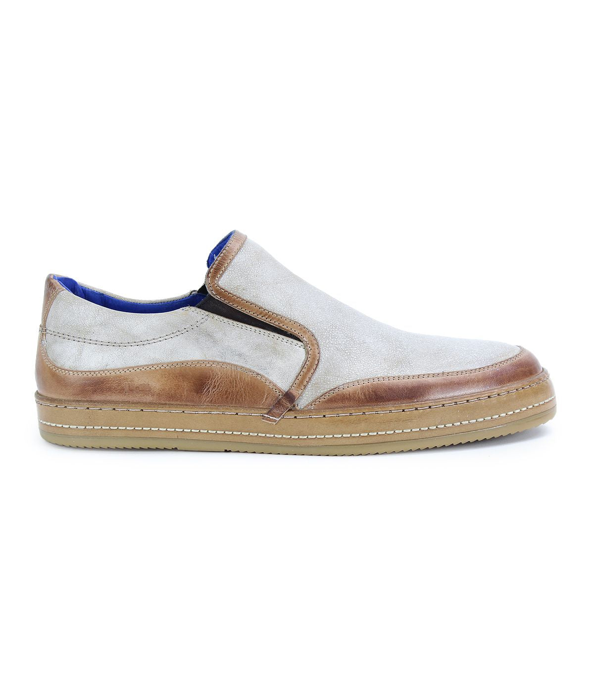 Experience effortless comfort with the Bed|Stü Freestyle slip-on sneaker, showcasing a light beige upper accented by tan leather trim and set on a tan rubber sole—presented from the side against a white background for an easygoing, stylish look.