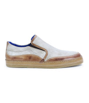 Experience effortless comfort with the Bed|Stü Freestyle slip-on sneaker, showcasing a light beige upper accented by tan leather trim and set on a tan rubber sole—presented from the side against a white background for an easygoing, stylish look.