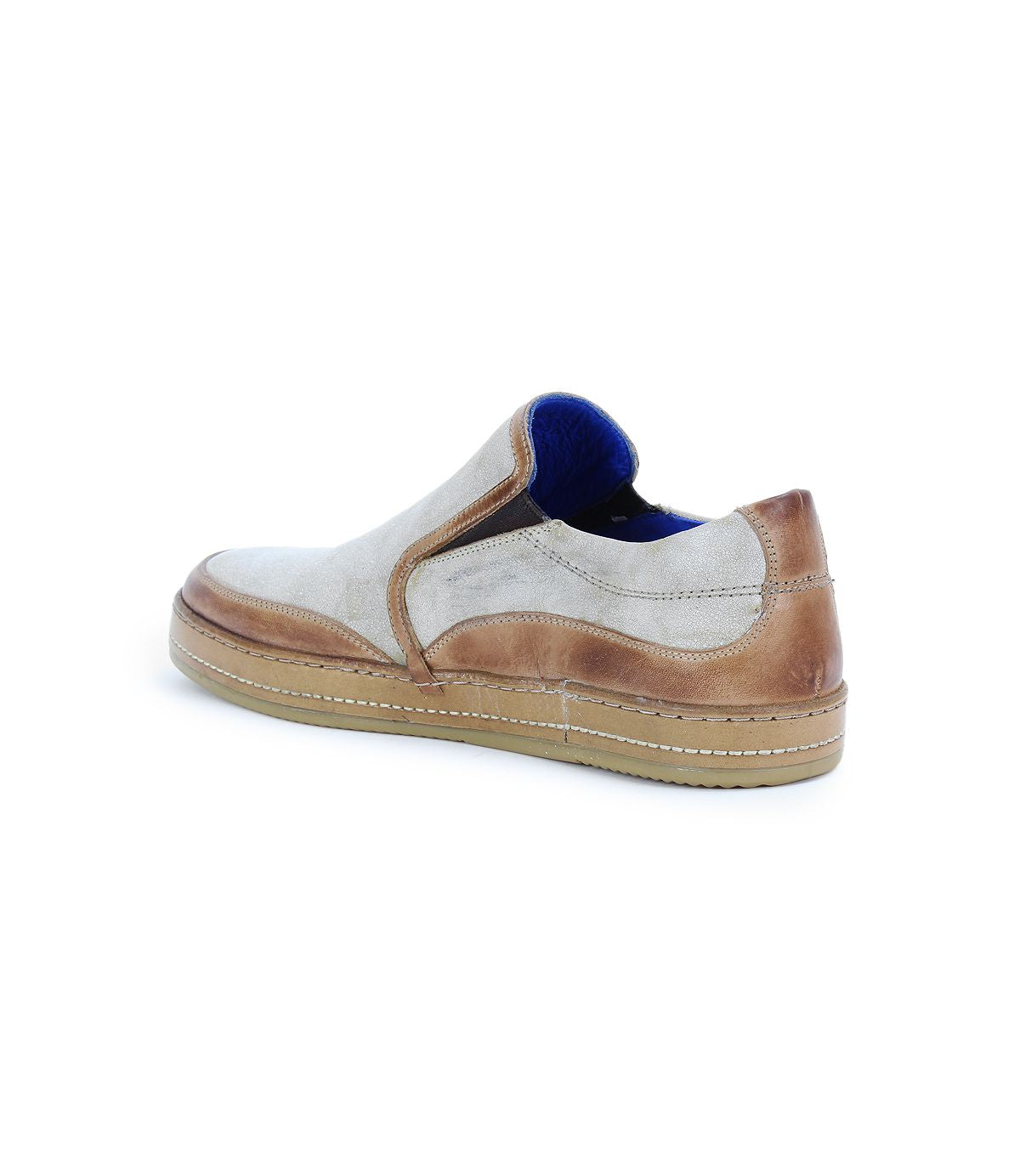 Freestyle slip-on sneaker by Bed|Stü in light beige and brown, featuring a tan sole, blue inner lining, leather trim, and visible stitching, shown from the rear side angle.