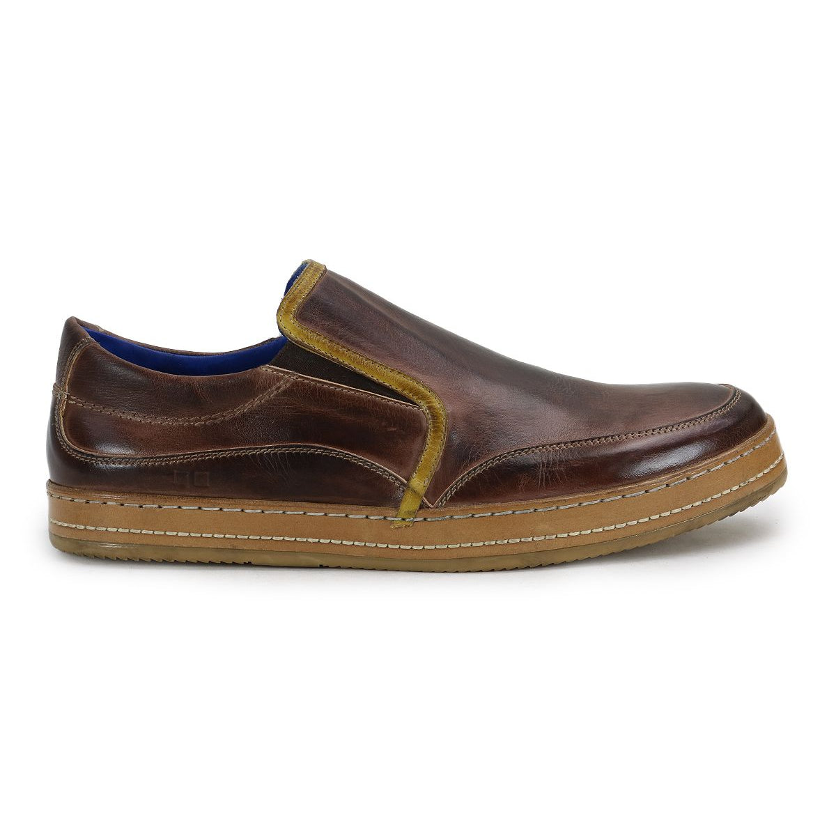 The Bed|Stü Freestyle is a brown leather slip-on sneaker featuring yellow leather trim, a blue interior lining, and a tan rubber sole, shown in side profile for a comfortably stylish look.