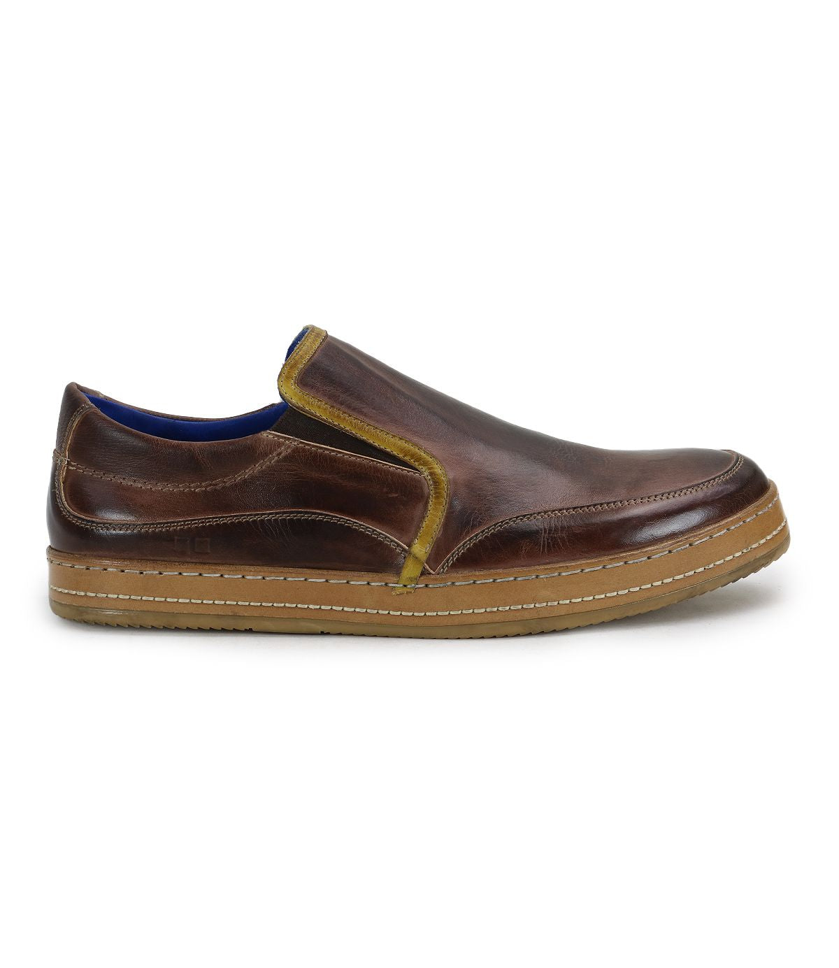 The Bed|Stü Freestyle is a brown leather slip-on sneaker featuring yellow leather trim, a blue interior lining, and a tan rubber sole, shown in side profile for a comfortably stylish look.