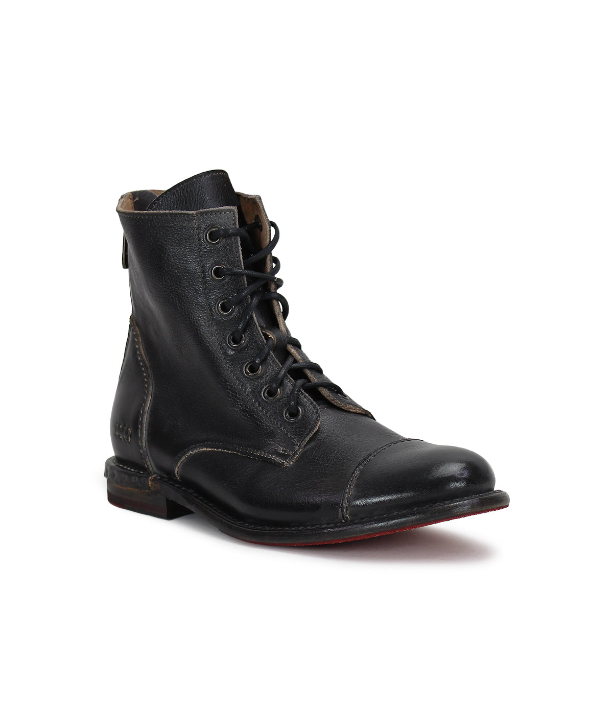 The Laurel by Bed|Stü is a single black leather combat-style boot featuring a slightly worn texture, visible stitching, a cap toe, and a low heel, photographed against a white background.