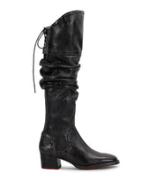 Introducing Leilani by Bed|Stü—a tall black leather boot featuring a slouchy shaft, pointed toe, low block heel, front stitching details, and elegant ruching with lace-up accents at the back.