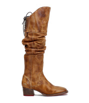 Introducing Leilani by Bed|Stü—a brown leather knee-high boot featuring elegant ruching along its slouchy shaft, decorative stitching, a low stacked heel, and stylish back laces for added flair. This eye-catching boot perfectly blends style and comfort.