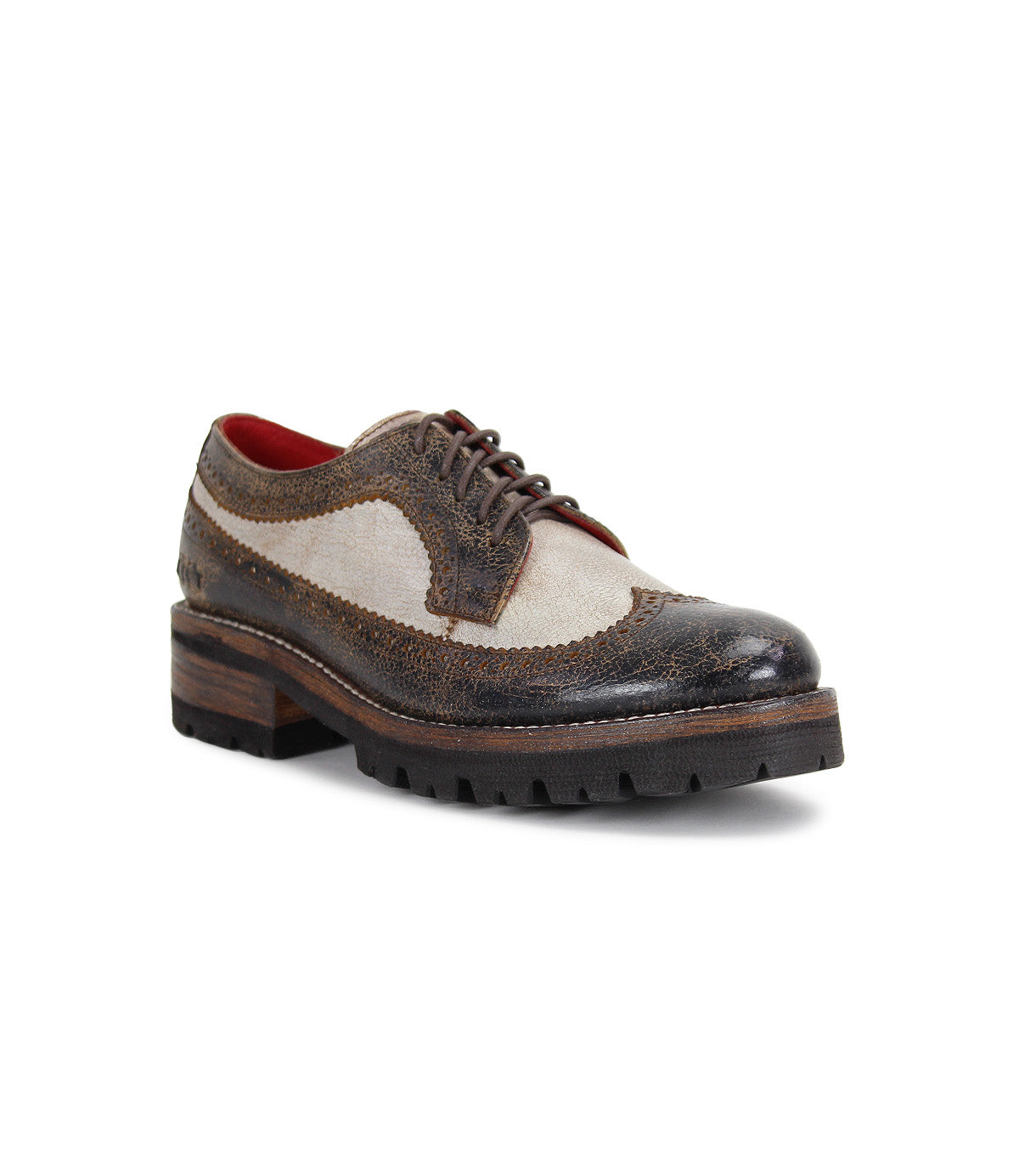 The Bed|Stü Lita K III is a vintage-inspired brown and beige leather wingtip brogue shoe, featuring textured detailing, a chunky sole, and visible laces. Displayed at an angle on a white background, this design seamlessly blends classic craftsmanship with modern flair.