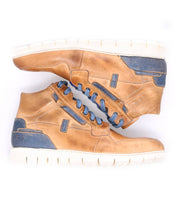 A pair of Bed|Stü Galahad tan high-top leather sneakers with blue accents and a lightweight sole, displayed side by side against a white background.