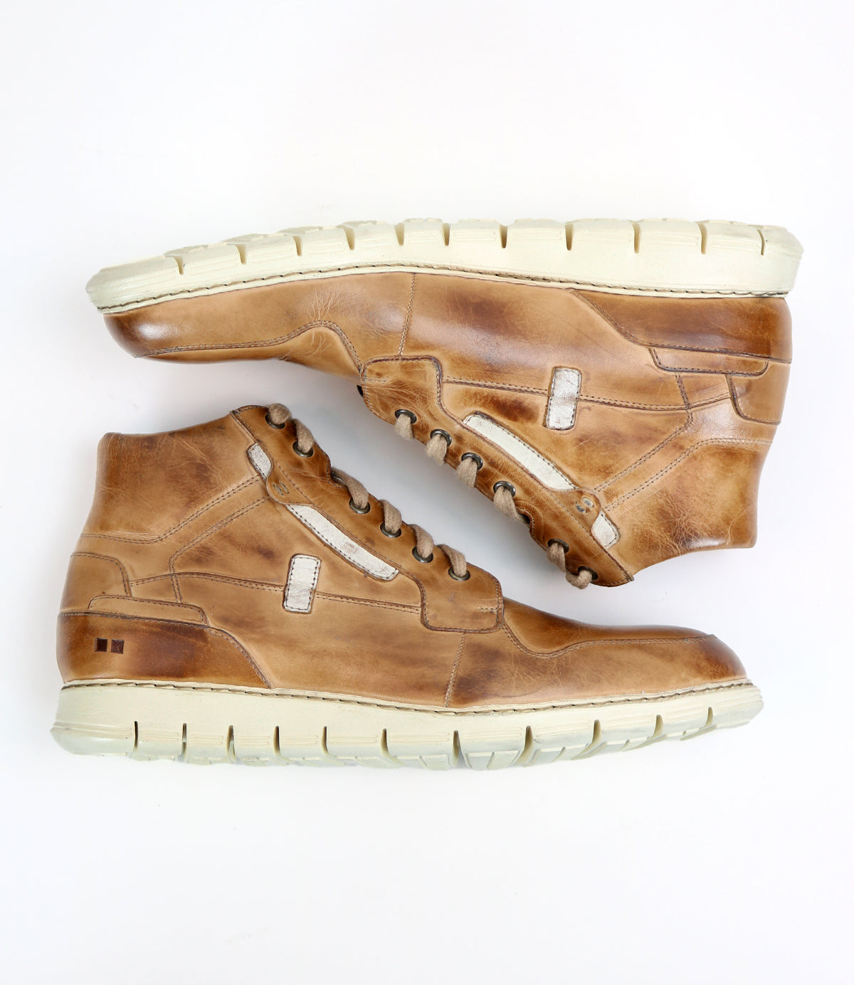 A pair of Bed|Stü Galahad tan leather high-top sneakers with a lightweight sole and white rubber accents, displayed side by side on a white background.