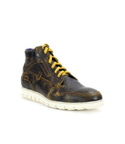 A single Bed|Stü Galahad high-top sneaker in brown leather, featuring yellow laces and a lightweight white rubber sole, is shown at an angle against a white background.