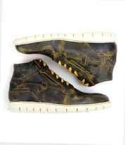 A pair of Bed|Stü Galahad high-top leather sneakers with white, lightweight soles is displayed side by side on a white background.