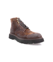 The Bed|Stü Goer boot is an Italian work-style cap-toe design, crafted from oiled suede leather with a rugged, worn texture and a thick black rubber sole, shown angled to the left on a white background.