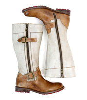 Introducing the Bed|Stü Gogo Lug Wide Calf boots—a sophisticated update on the classic engineer silhouette, these knee-high leather boots feature a brown leather foot and top trim, an off-white shaft, practical side zipper, and eye-catching decorative buckles.