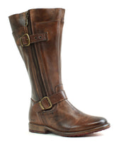 The Bed|Stü Gogo Lug Wide Calf is a brown leather mid-calf boot featuring a side zipper, two buckle straps, and a low stacked heel in classic engineer boot style, shown against a white background.