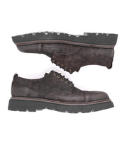 A pair of Grant cap-toe derby shoes by Bed|Stü, crafted from dark brown Italian leather with thick, rugged black soles, displayed side by side on a white background.