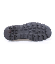 Black sole of the Bed|Stü Grant hiking boot with deep, rugged treads, shown from the bottom against a white background—reflecting the durable craftsmanship characteristic of Italian leather footwear.