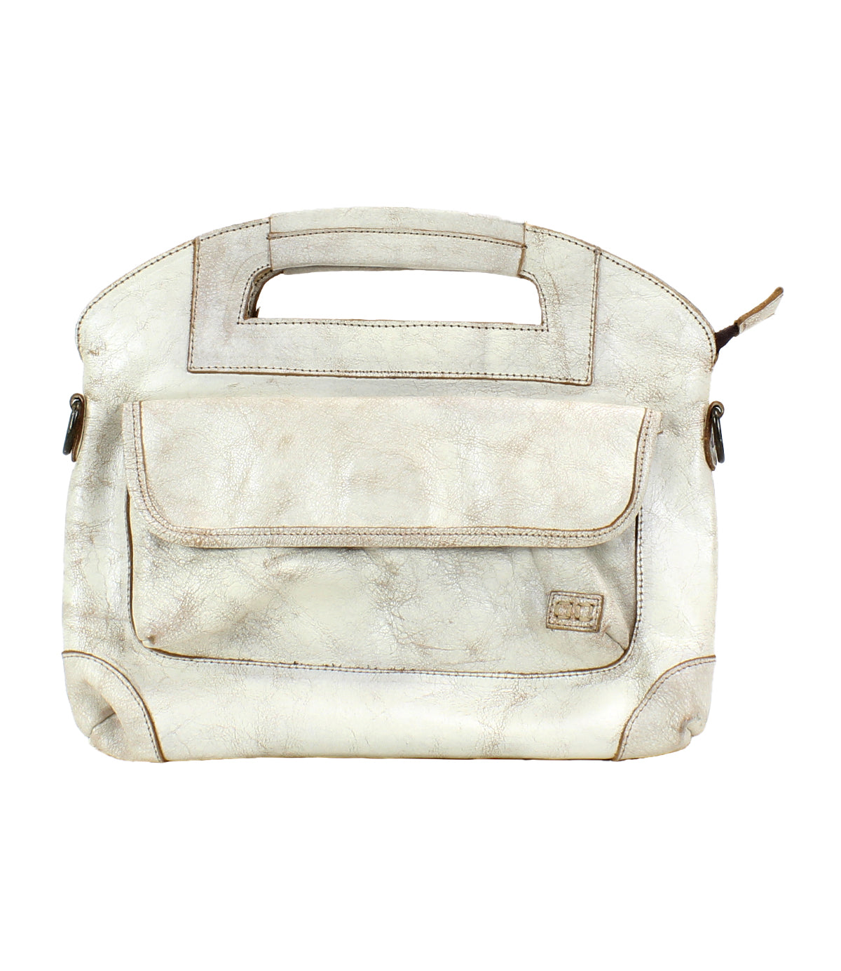 The Bed|Stü Greenway is a beige full-grain leather handbag featuring a rectangular cutout handle, a front pocket with flap, and visible stitching. Shown against a white background, this versatile bag includes a detachable crossbody strap for hands-free convenience.
