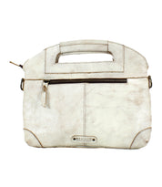 The Bed|Stü Greenway is an off-white full-grain leather handbag featuring a short handle, zip-top closure, front zippered pocket, and a metal "Bed|Stü" label on the bottom center.
