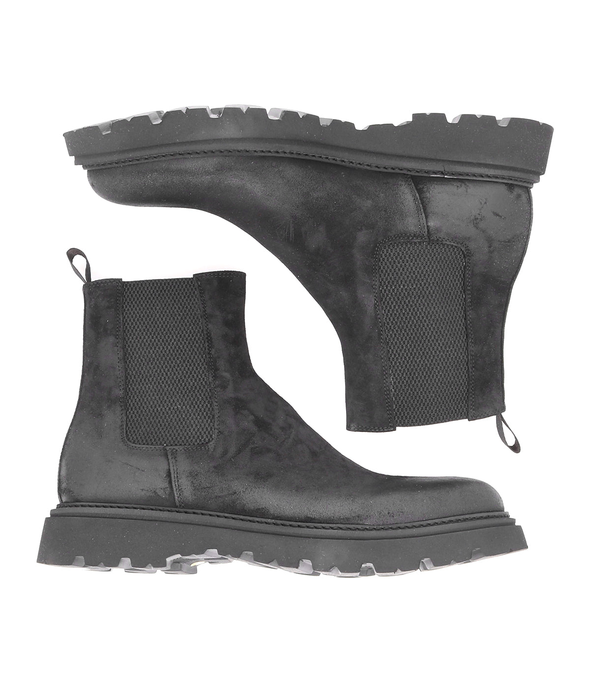 Pair of black men's Grit Chelsea boots by Bed|Stü, featuring thick, rugged soles and elastic side panels, shown from both a side view and a sole view on a white background. These Italian handcrafted boots are designed for both style and durability.