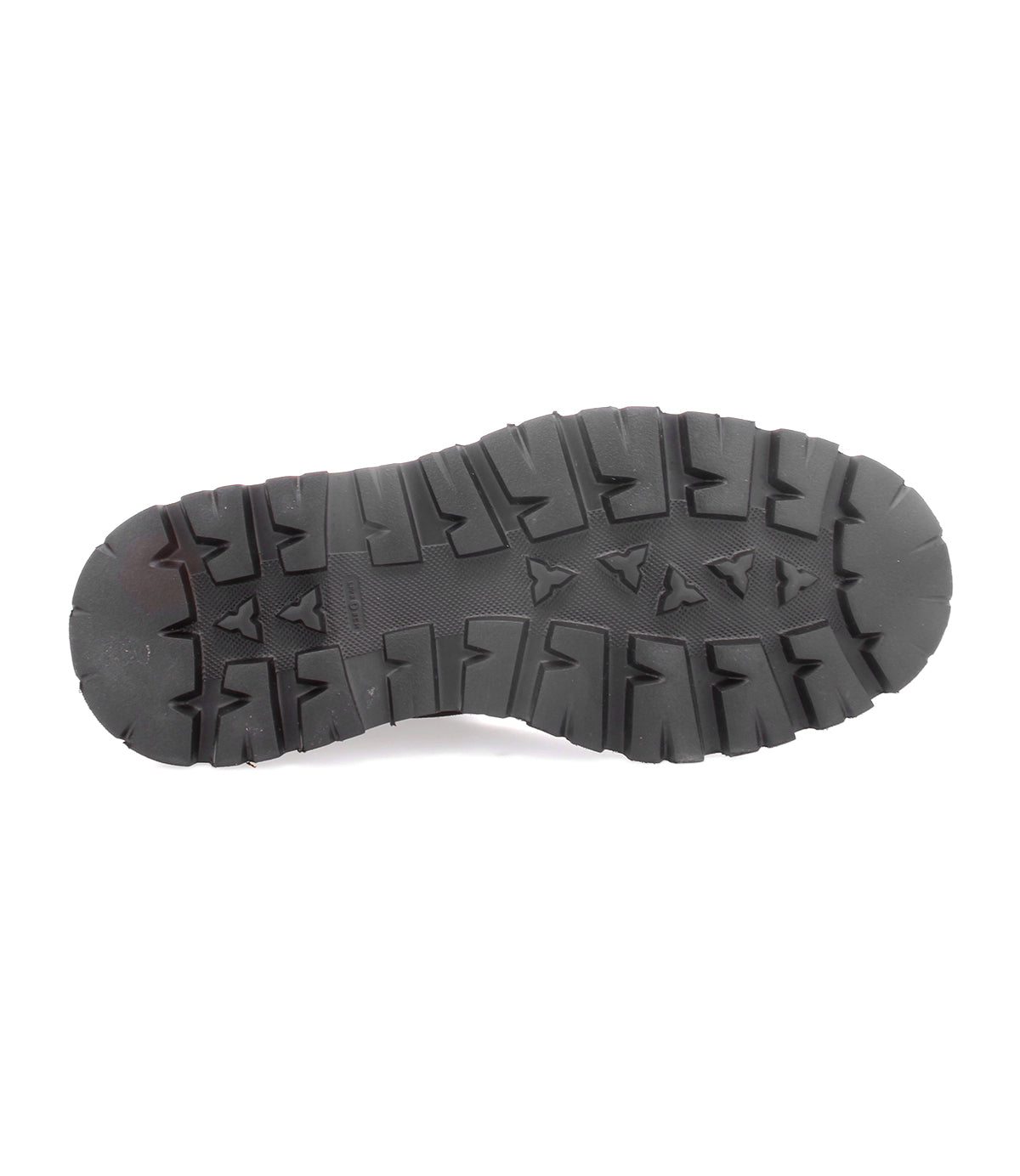 Bed|Stü’s Grit: a black rubber sole featuring deep, rugged treads and triangular patterns—ideal for Italian handcrafted boots—shown from the bottom on a white background.