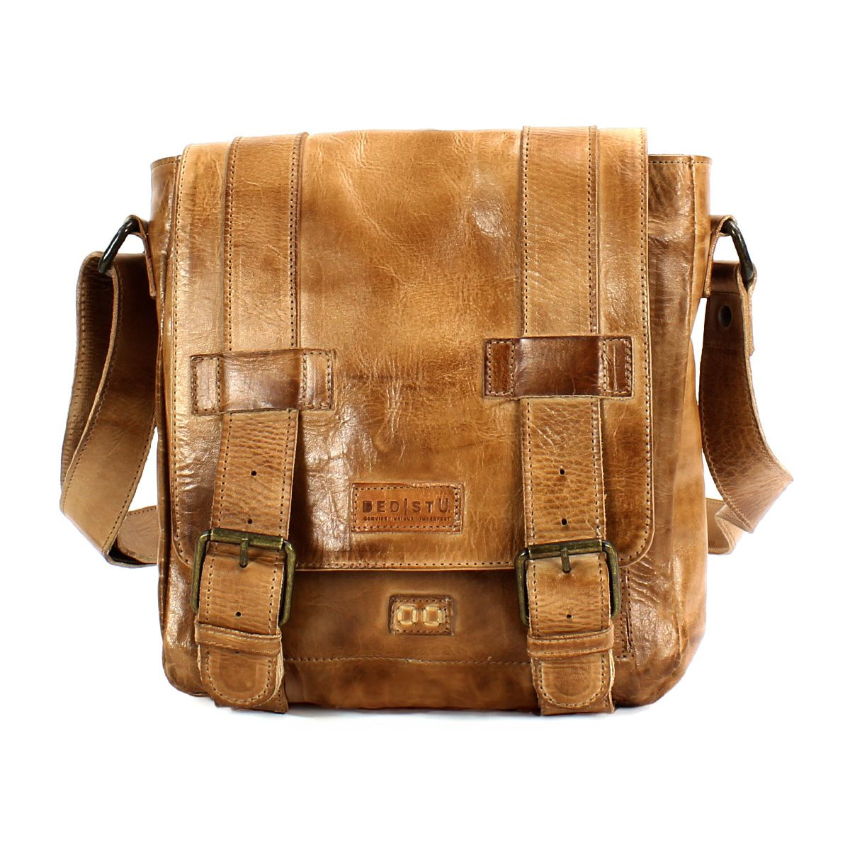The Bed|Stü Hue messenger bag is crafted from brown leather and features a front flap with dual buckle closures and a stamped logo on the front. An adjustable crossbody strap ensures comfort and versatility, making the Hue perfect for carrying your essentials from work to weekend.