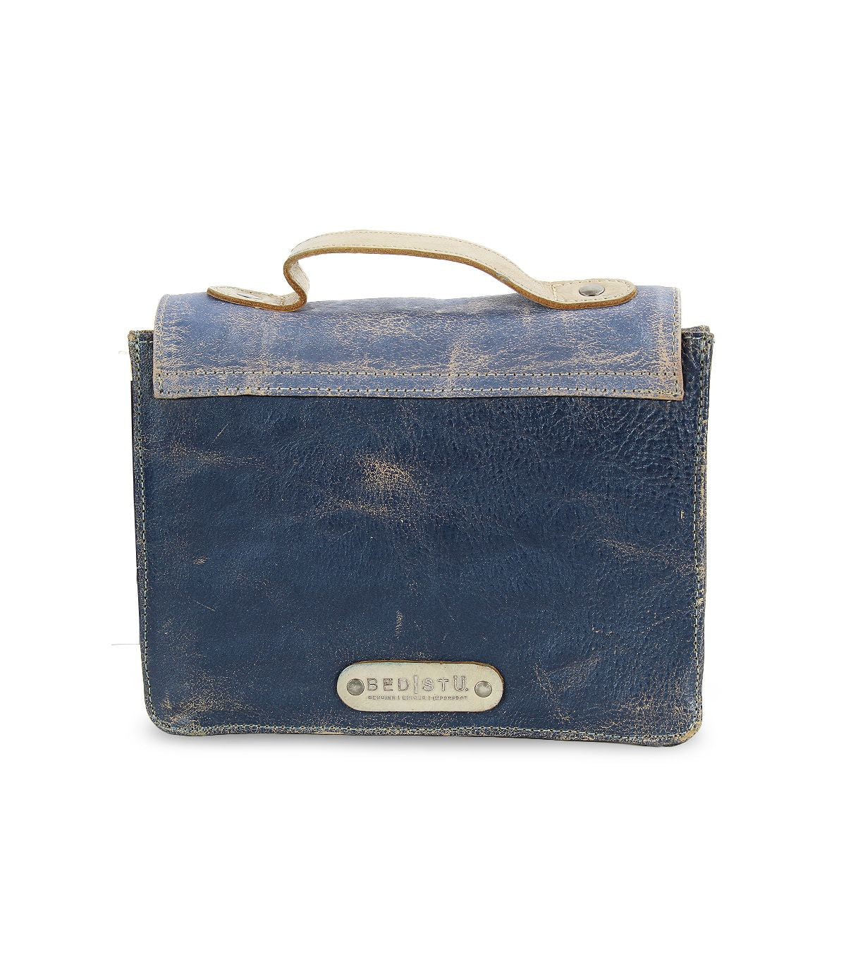 A compact, rectangular blue leather mini purse called Improv by Bed|Stü, featuring a top handle and a metal label on the front.