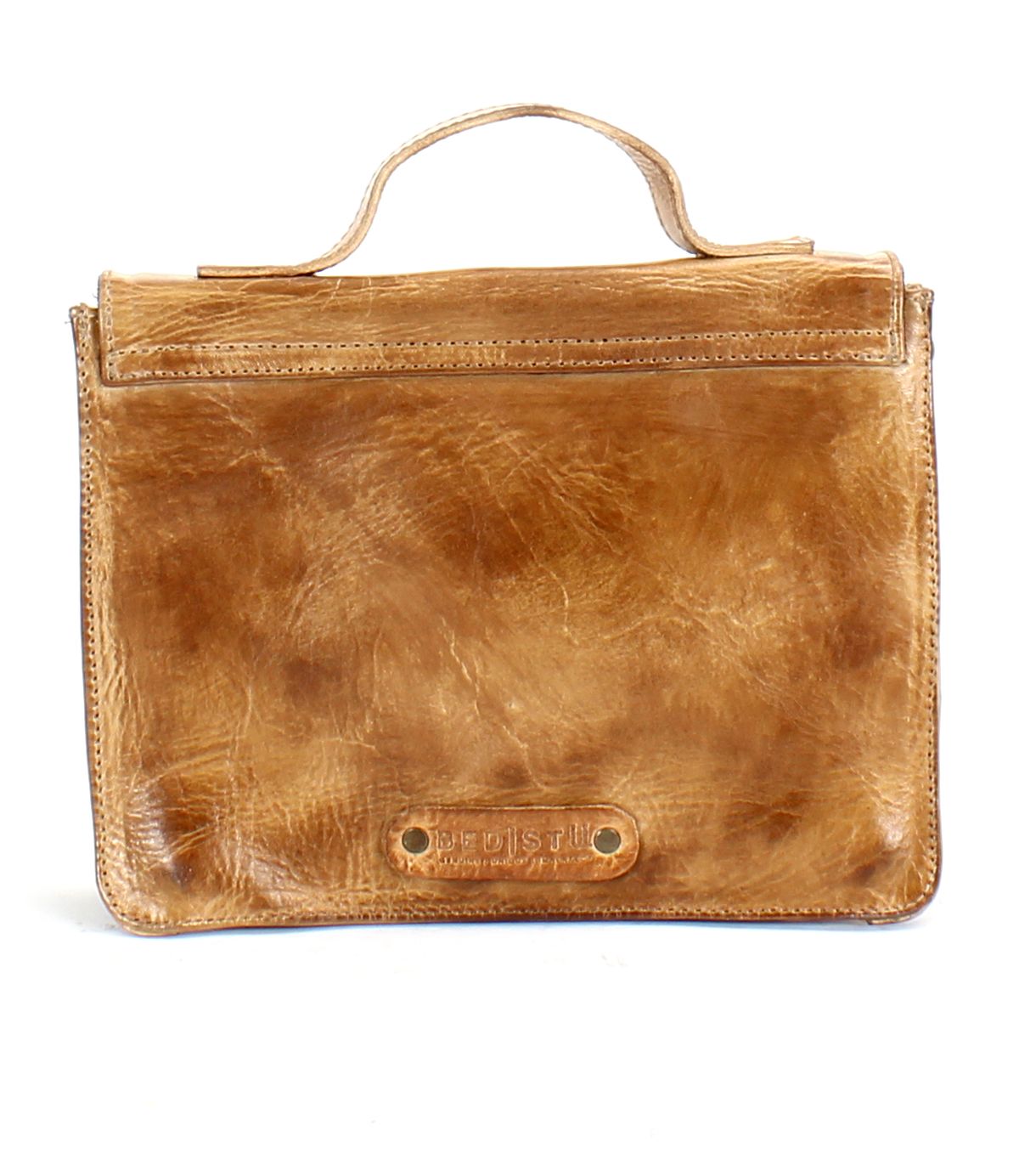 The Bed|Stü Improv is a brown leather briefcase-style bag featuring a top handle and visible stitching, shown against a white background.