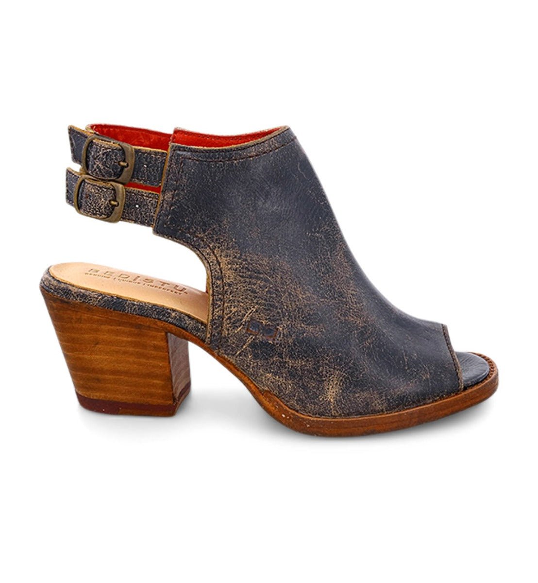 Introducing the Ireni by Bed|Stü, a women’s peep toe heeled sandal crafted from distressed black leather. Featuring two side buckles and a sturdy wooden block heel, this stylish sandal is designed with a cushioned footbed to provide comfort and style for any occasion.