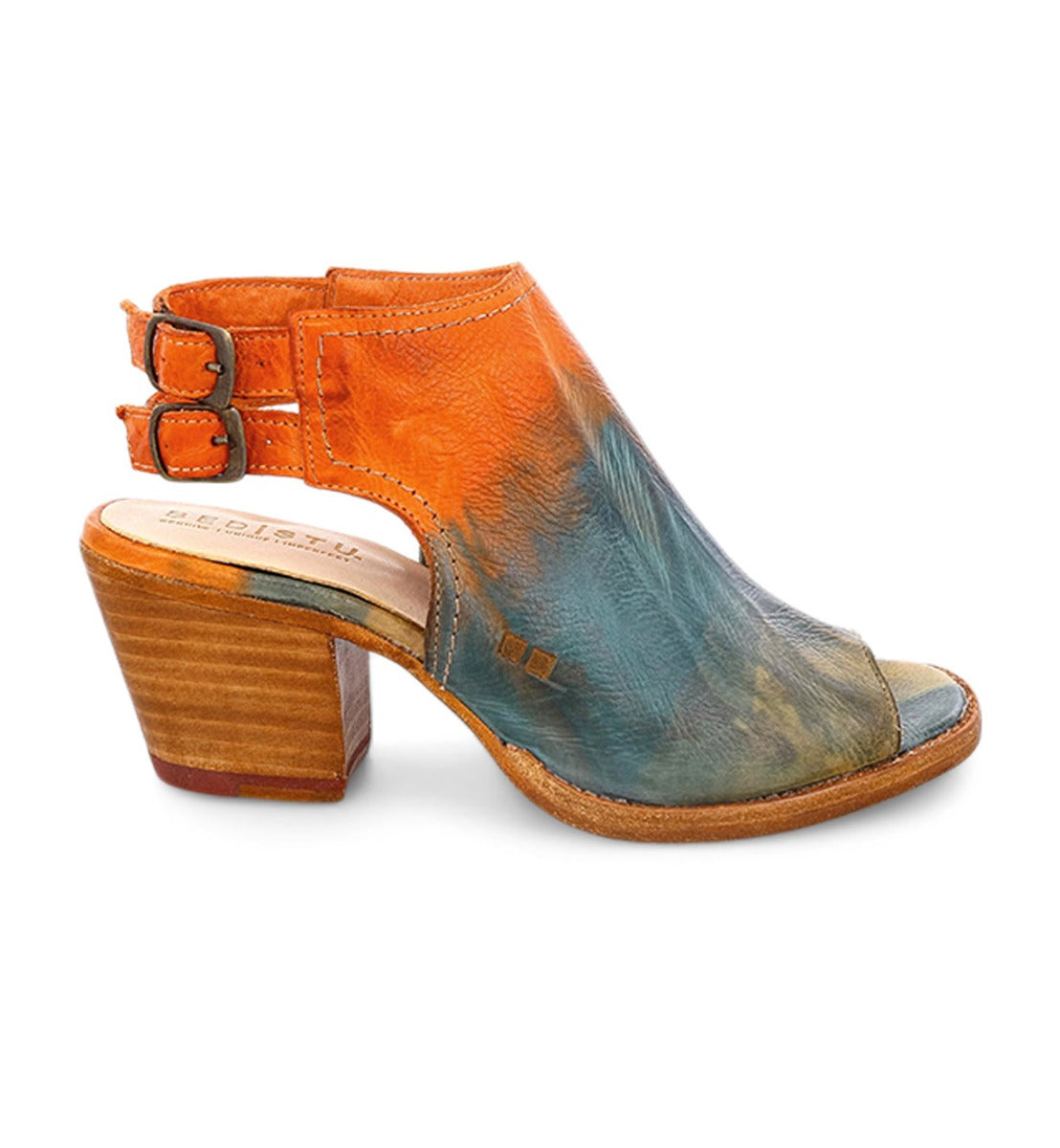 The Ireni by Bed|Stü is a high-heeled sandal featuring a leather peep toe, a striking multicolored upper in vibrant orange and blue tones, two side buckles, a cushioned footbed for all-day comfort, and a wooden stacked heel—making it the perfect choice for your new everyday heel.