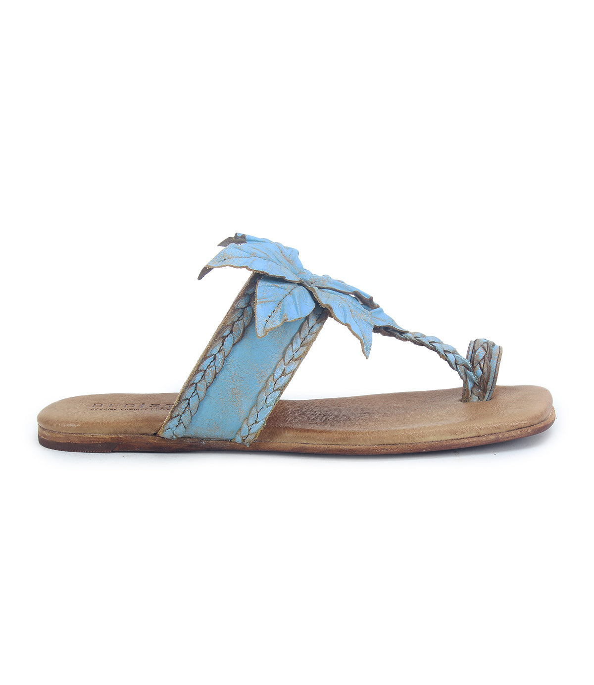 Discover the Isobel sandal by Bed|Stü—a single blue leather flat featuring a braided strap, decorative leaf accents, and a stylish toe loop, shown in profile view—an ideal finishing touch for your summer outfits.