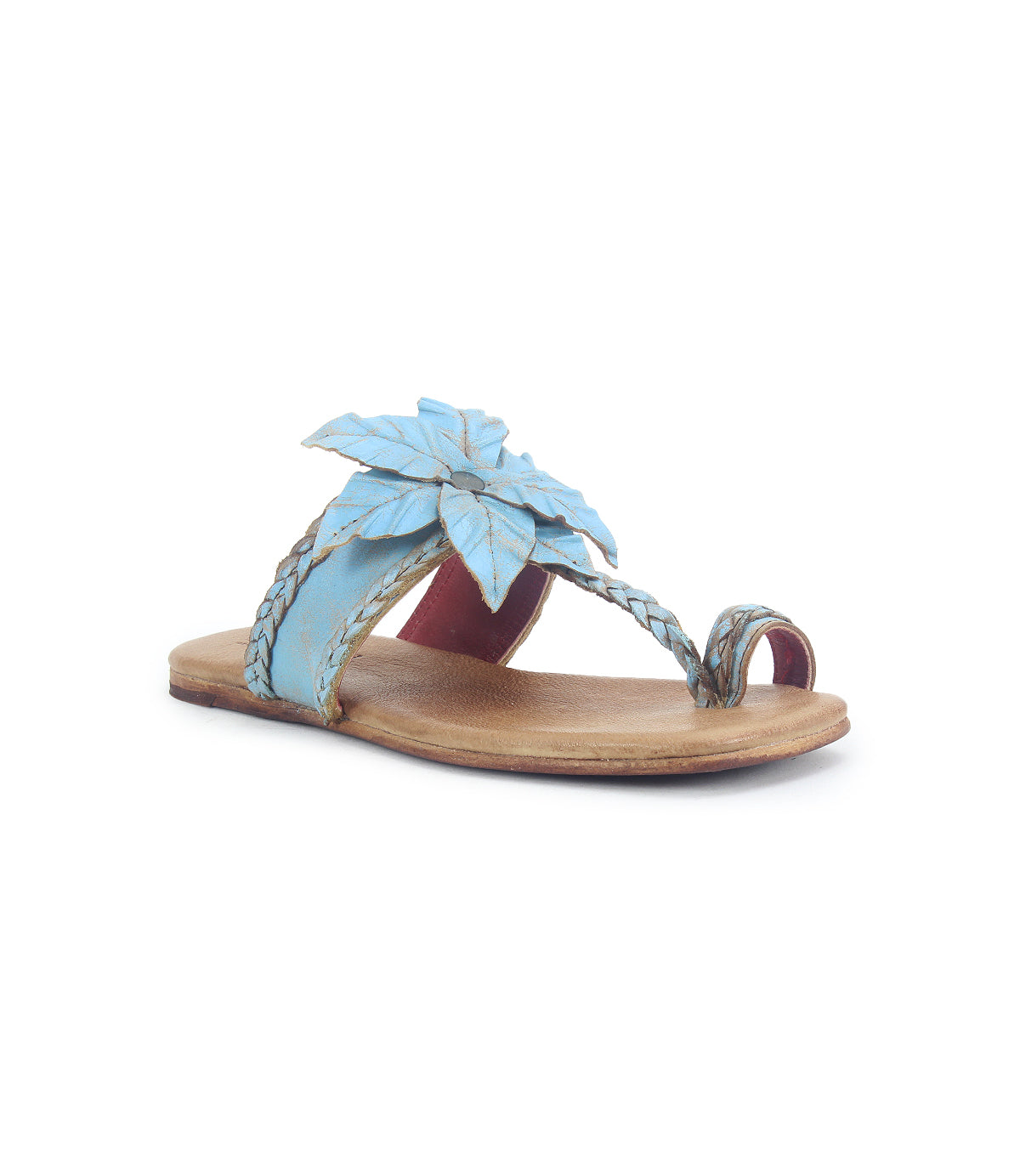Step into effortless summer style with the Isobel sandal from Bed|Stü, featuring a tan leather sole and striking blue upper strap adorned with a bold, leaf-shaped embellishment. Braided detailing around the toe loop and strap adds an artisanal touch, making these sandals the perfect choice for chic, laid-back looks.