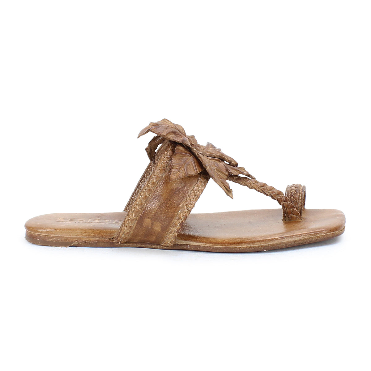 Step out in effortless summer style with the Isobel sandal from Bed|Stü—a brown leather flat featuring a braided thong strap and a detailed leaf accent on the upper.