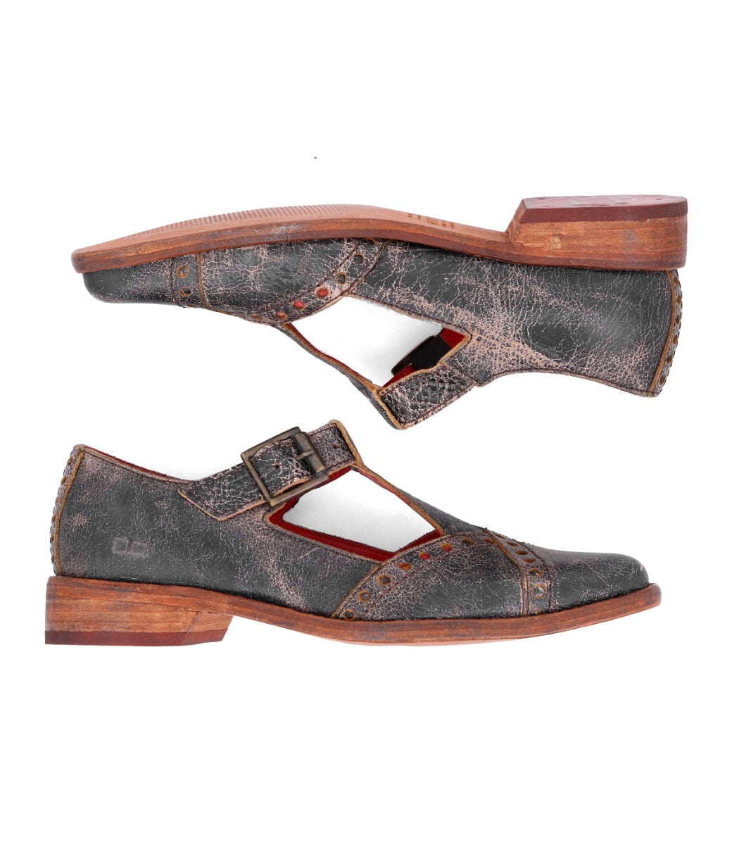 A pair of Bed|Stü’s "Jenny" vintage-inspired, brown leather Mary Jane T-strap shoes with buckles and low wooden heels are shown horizontally, one above the other to highlight the side profile and sole. The design includes a cushioned insole for enhanced comfort.