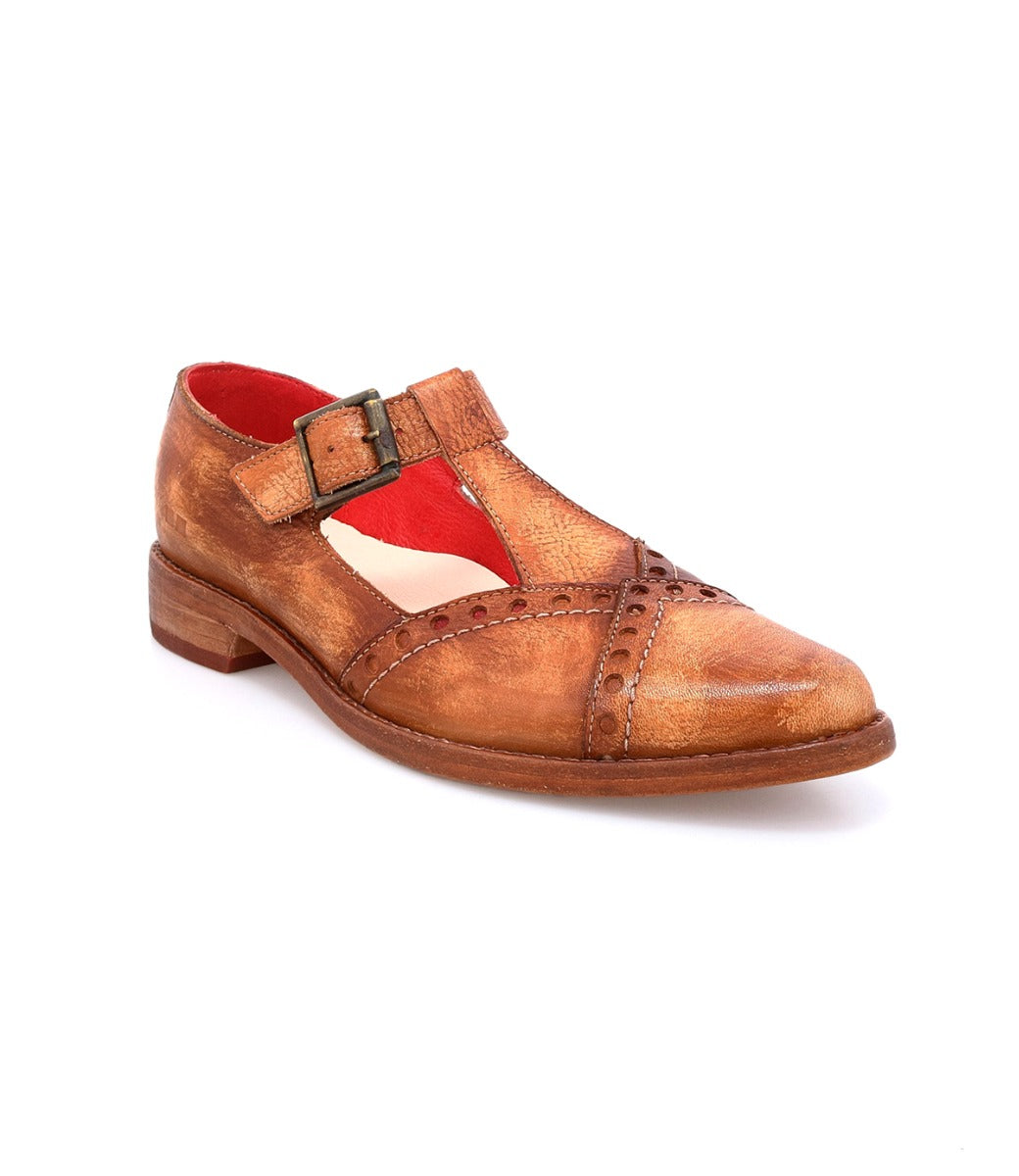 The Jenny by Bed|Stü is a brown vintage-style leather Mary Jane shoe featuring a buckle strap, T-strap cut-out details, red inner lining, cushioned insole, and a low wooden heel, photographed on a white background.