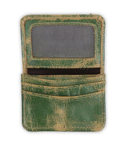 A worn green rustic leather Jeor card wallet by Bed|Stü, featuring a transparent ID window and two credit card slots, is displayed open against a white background.