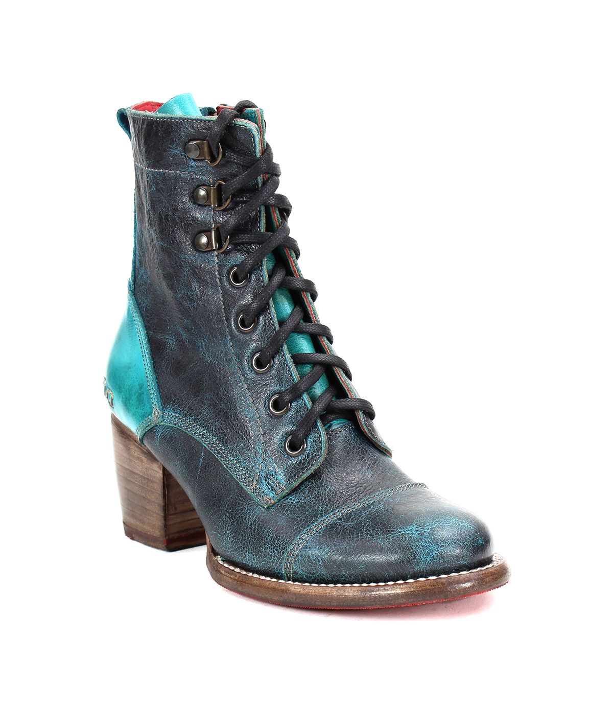 Introducing Judgement by Bed|Stü: a high-heeled lace-up boot crafted from distressed blue leather with turquoise accents, featuring a wooden block heel, cap toe detailing, and contrast stitching.