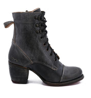 Bed|Stü’s Judgement is a black leather lace-up boot featuring a cap toe, thick block heel, visible stitching, and a pull tab at the back.