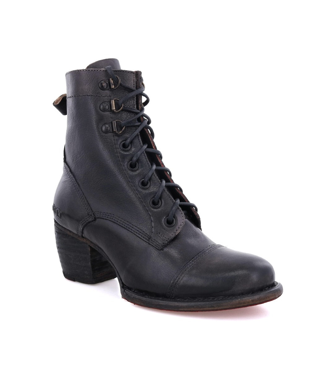 The Judgement boot by Bed|Stü is a black leather lace-up style featuring a block heel, cap toe, and stitched detailing, shown against a white background.