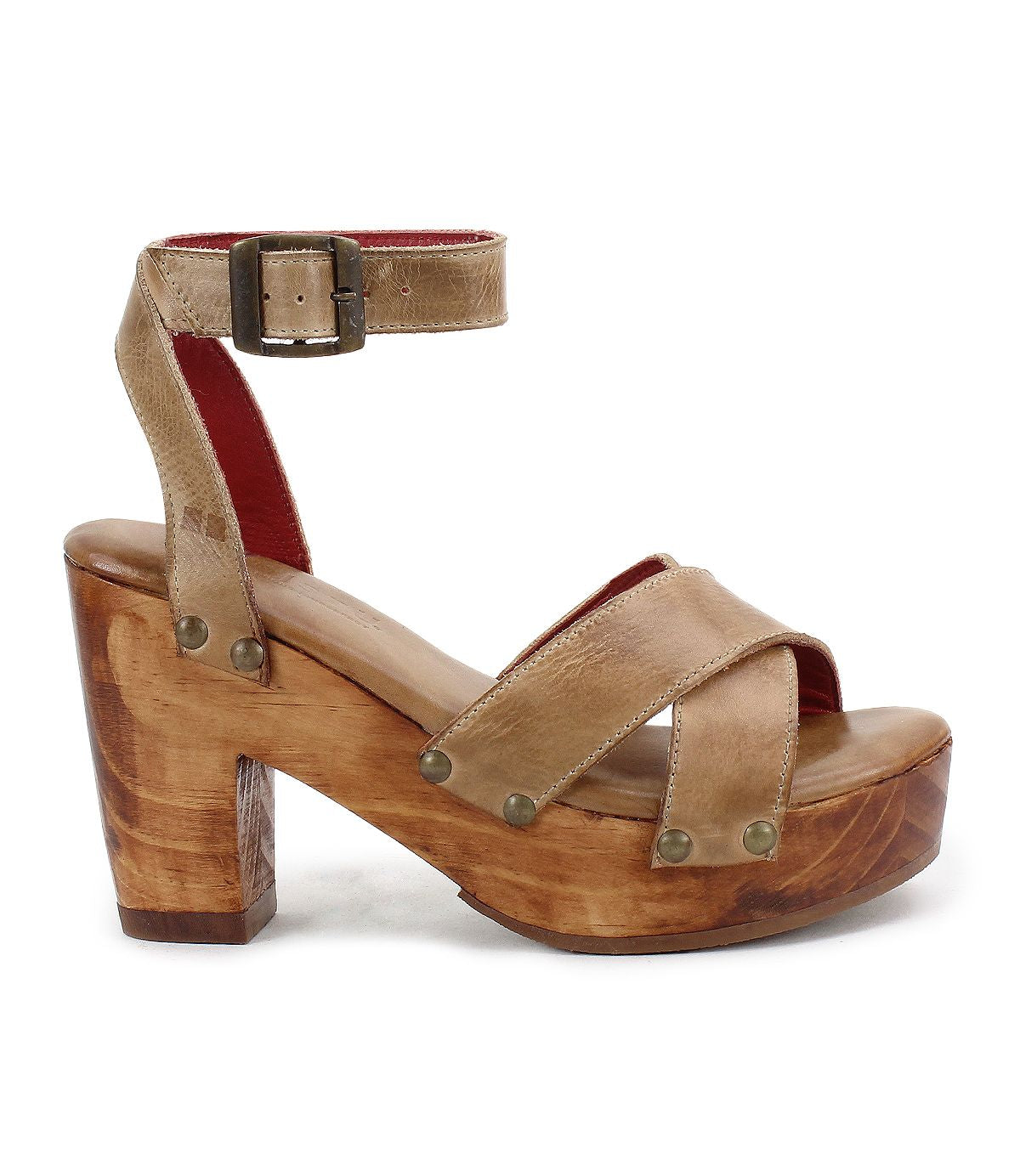 The Kalah platform sandal by Bed|Stü features wide tan leather straps, an adjustable ankle strap, and a sustainably sourced wooden block heel, shown in side profile against a plain white background.