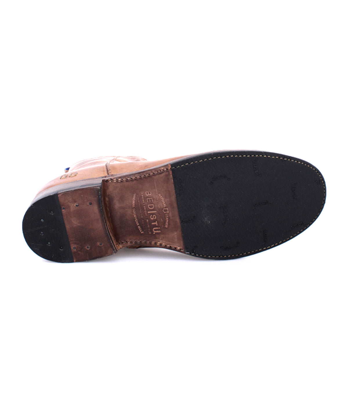 A brown leather Kaldi dress shoe by Bed|Stü is displayed from below, emphasizing its black rubber sole and heel—details that showcase the refined craftsmanship characteristic of classic boots.