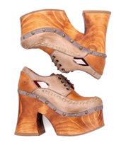 A pair of Bed|Stü "Karaoke" vintage 70s shoes featuring chunky wooden platform heels, tan leather uppers, decorative studs, and cutout side details, photographed on a white background.