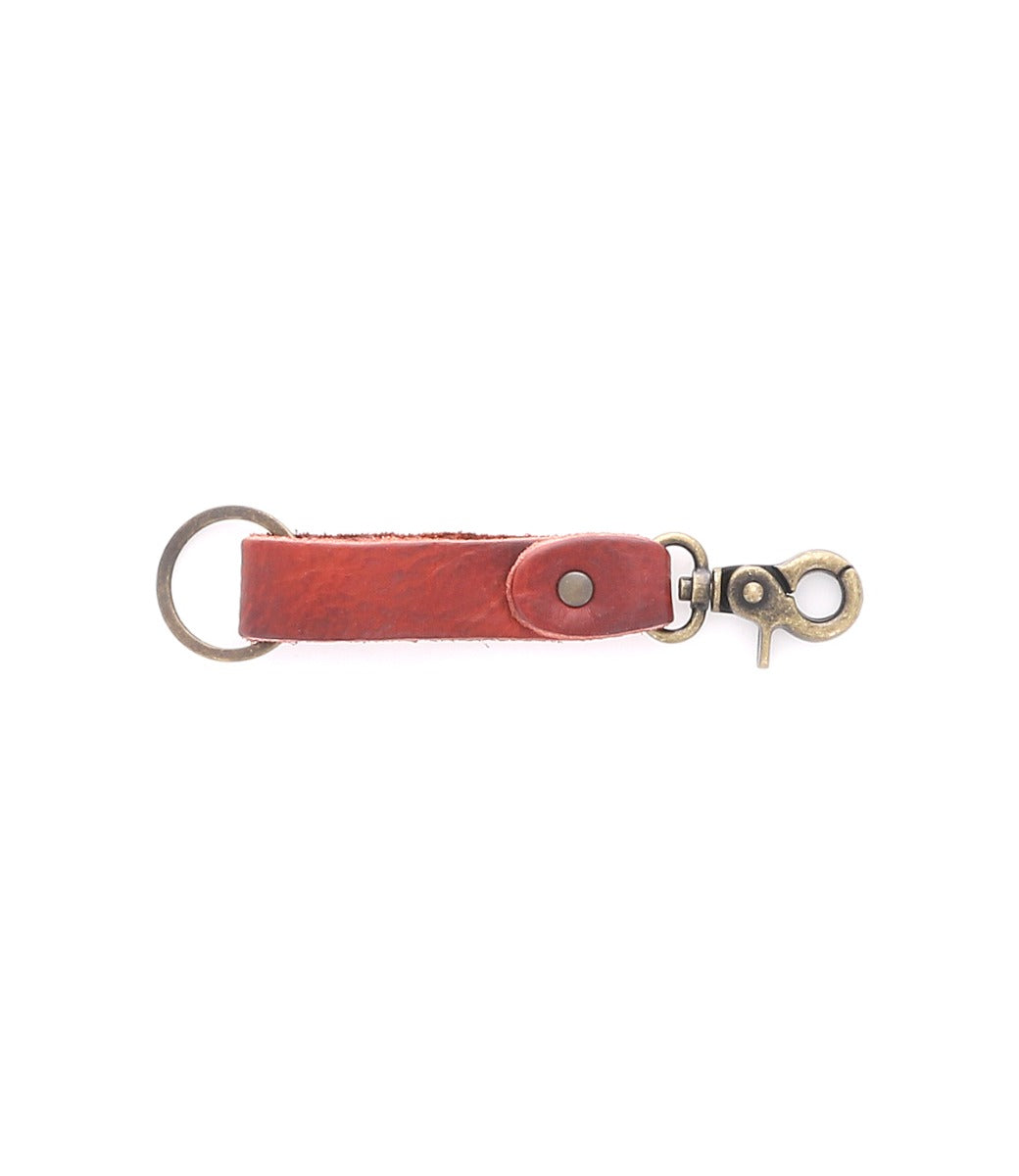 The Bed|Stü Keygrab is a brown full grain leather keychain featuring a metal keyring on one end and a swivel clip on the other, shown against a white background.