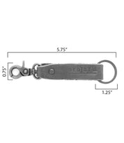Introducing the Bed|Stü Keygrab: a gray full grain leather keychain featuring a swivel clip, metal keyring, and prominent "BED|STÜ" embossing. Measuring 5.75 inches long and 0.75 inches wide with a 1.25-inch diameter keyring, it’s a stylish solution for organizing your keys every day.