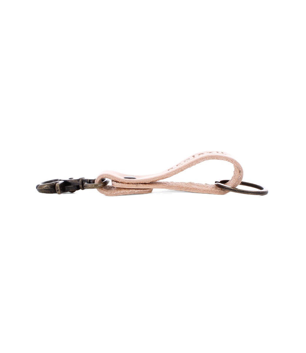 The Bed|Stü Keygrab is a tan full grain leather keychain featuring a looped design, metal keyring, and swivel clip clasp, shown on a white background.