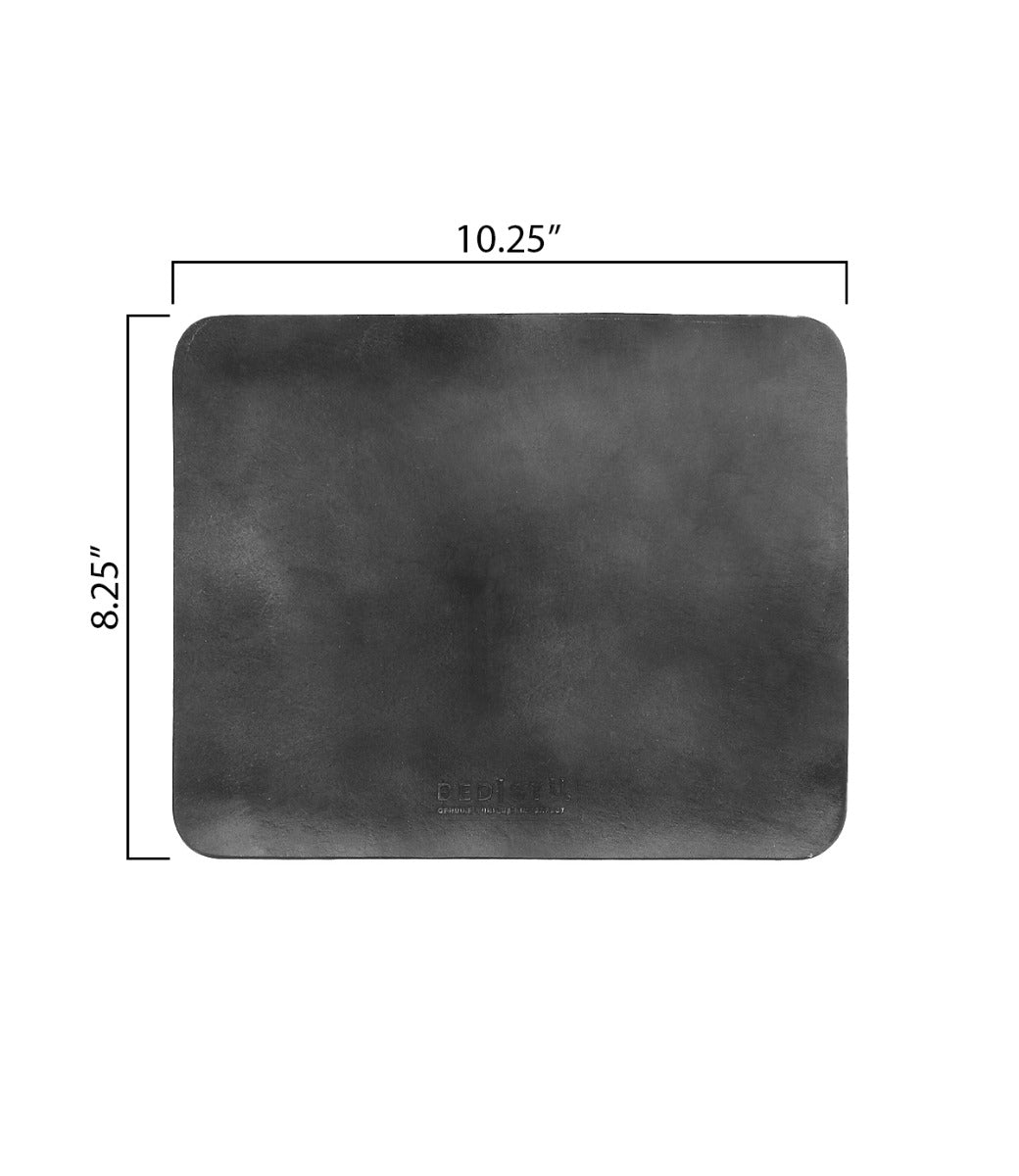 The Bed|Stü Launcher Mouse Pad is a rectangular black leather desk pad with rounded corners, measuring 10.25 inches wide by 8.25 inches high—perfect as a stylish workspace accessory or mouse pad.