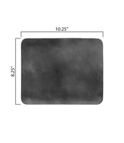 The Bed|Stü Launcher Mouse Pad is a rectangular black leather desk pad with rounded corners, measuring 10.25 inches wide by 8.25 inches high—perfect as a stylish workspace accessory or mouse pad.