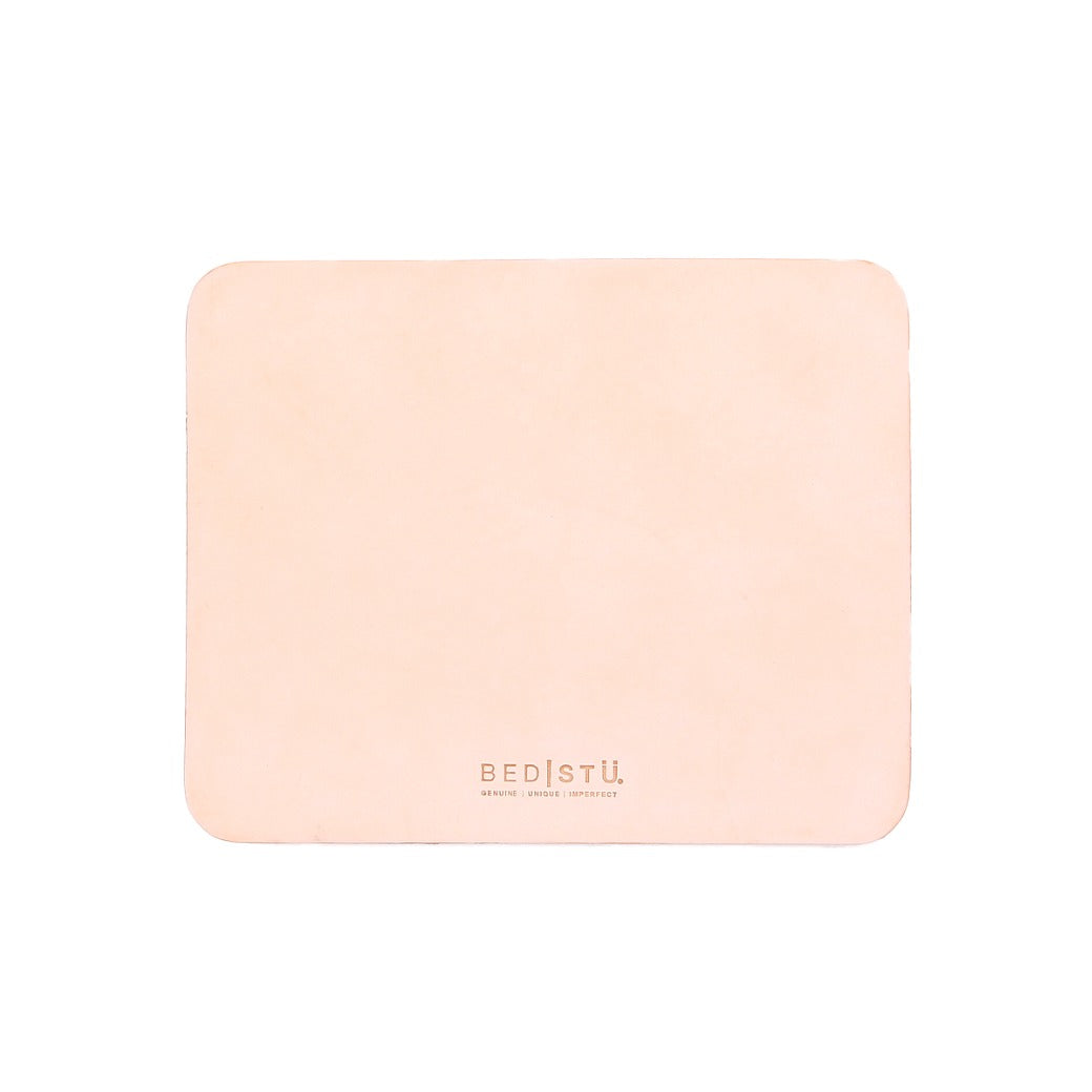 Rectangle beige leather Launcher Mouse Pad with rounded corners, featuring the Bed|Stü logo and tagline printed in small text near the bottom center. This versatile workspace accessory is perfect for enhancing your desk setup. Shown on a plain white background.