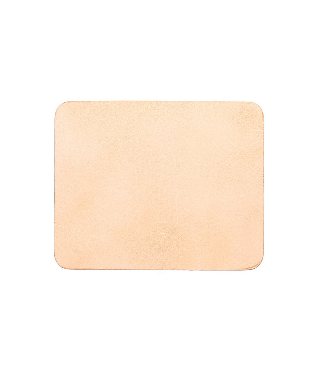The Bed|Stü Launcher Mouse Pad is a rectangular, blank, light tan leather accessory with rounded corners—shown on a white background—making it the perfect sophisticated addition to any office or workspace.